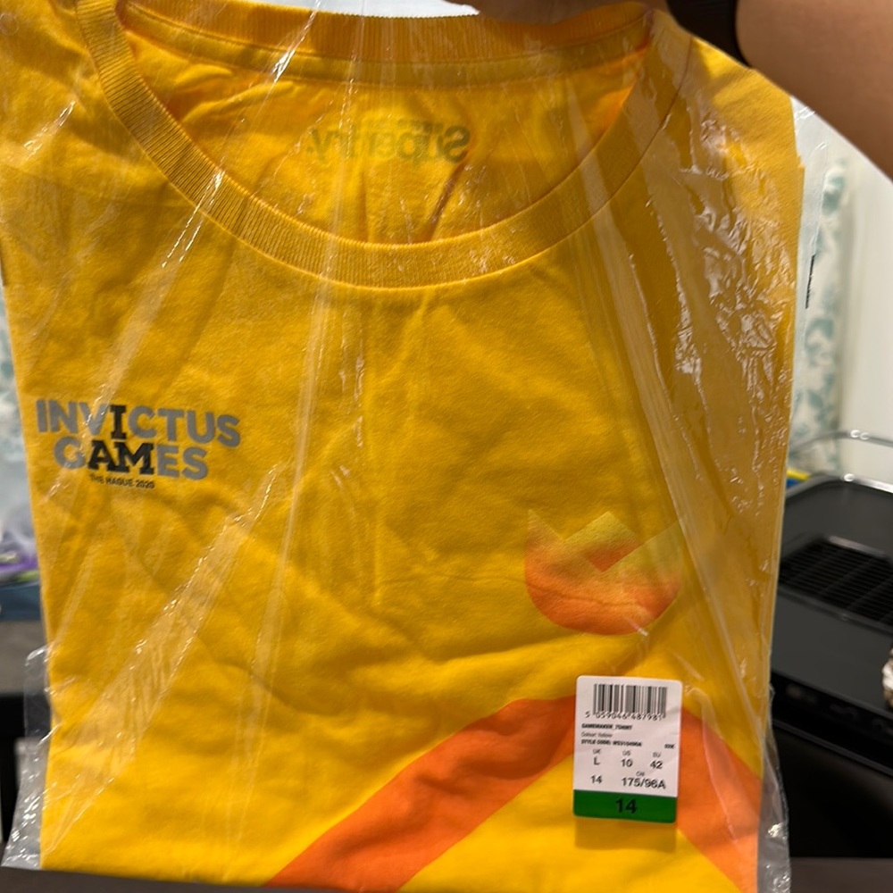 Women’s Invictus games yellow shirt